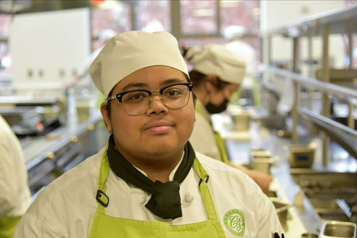 Ren Natividad stands in the training kitchen at Seattle Central's Culinary Academy. 